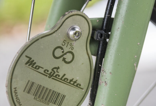 fietsplaatje van Mo-Cyclette dat aangeeft dat 51% van de fiets gerecycleerd is